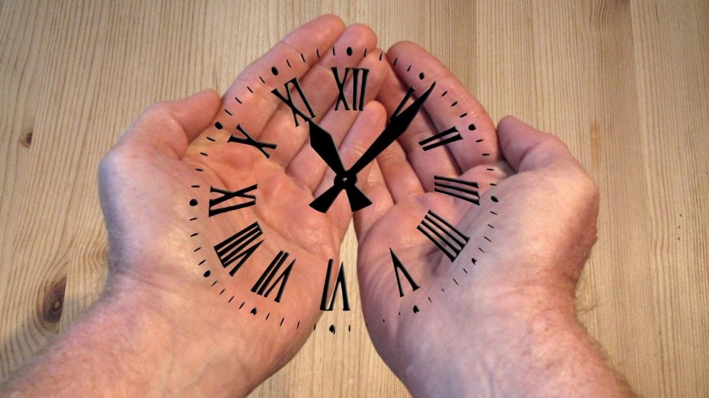 Time clock print on a man's hands