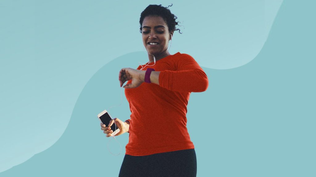 woman tracking her progress in digital wrist watch pedometer